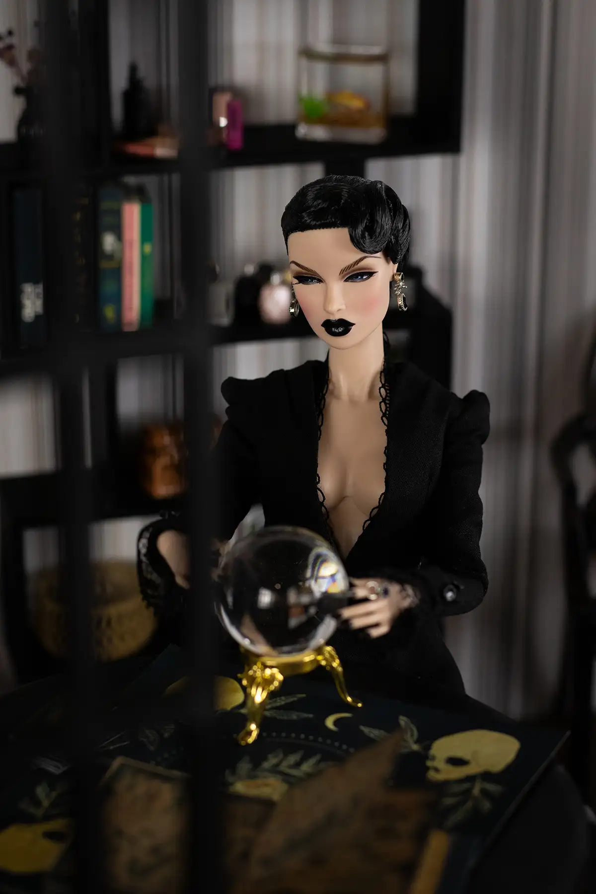 Eugenia Perrin-Frost doll sitting with a crystal ball
