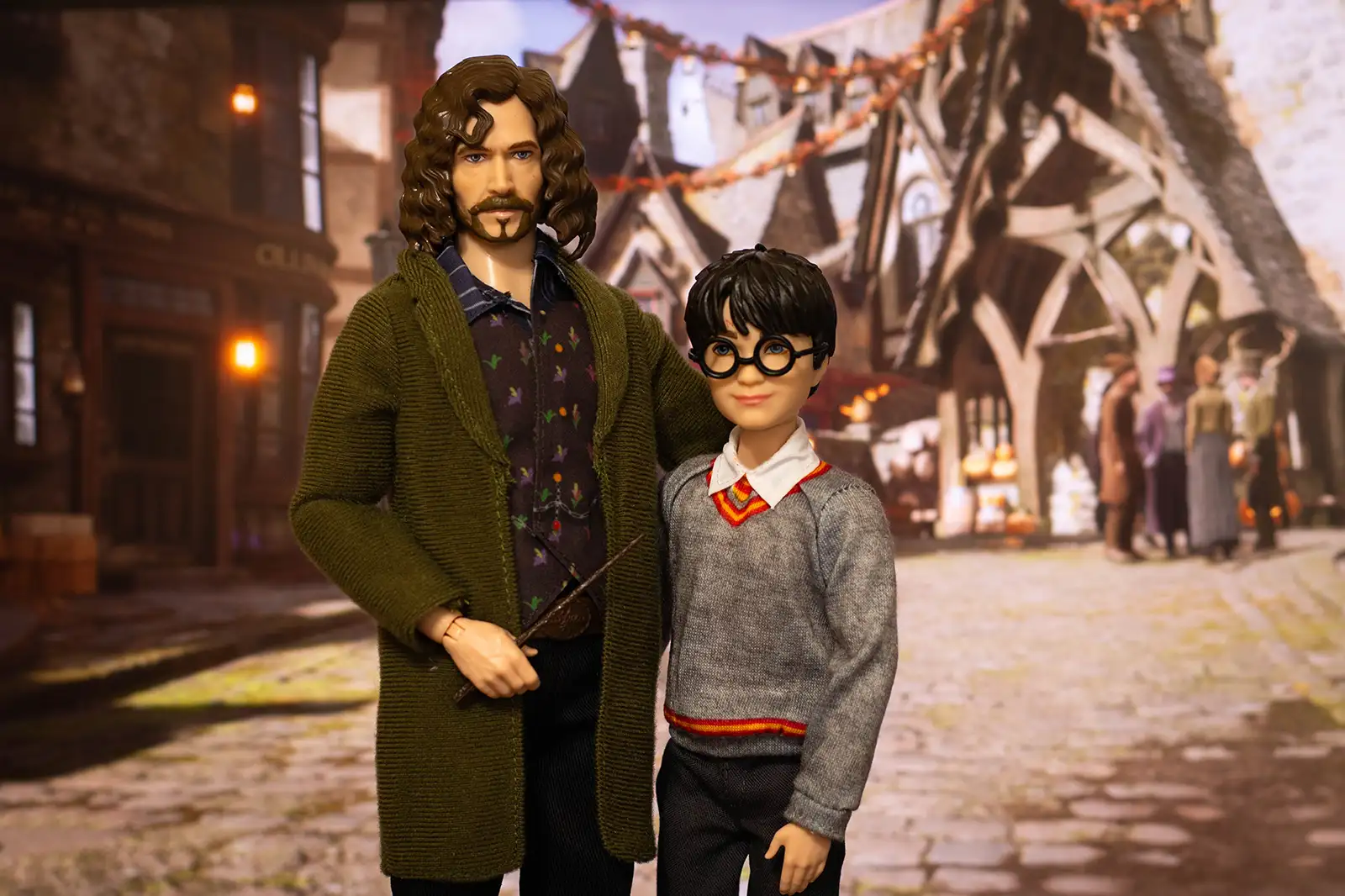 Mattel Sirius Black and Harry Potter dolls posed together in Hogsmeade