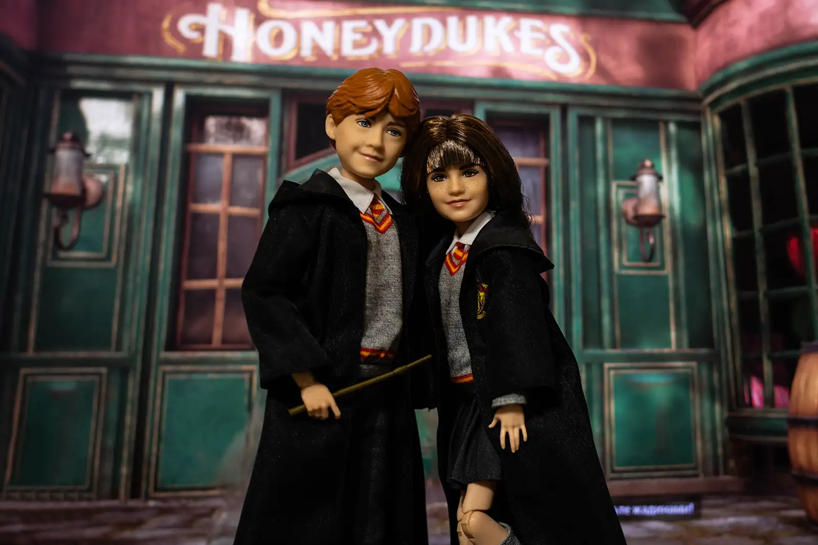 Mattel Ron Weasley and Hermione Granger dolls together near Honeydukes