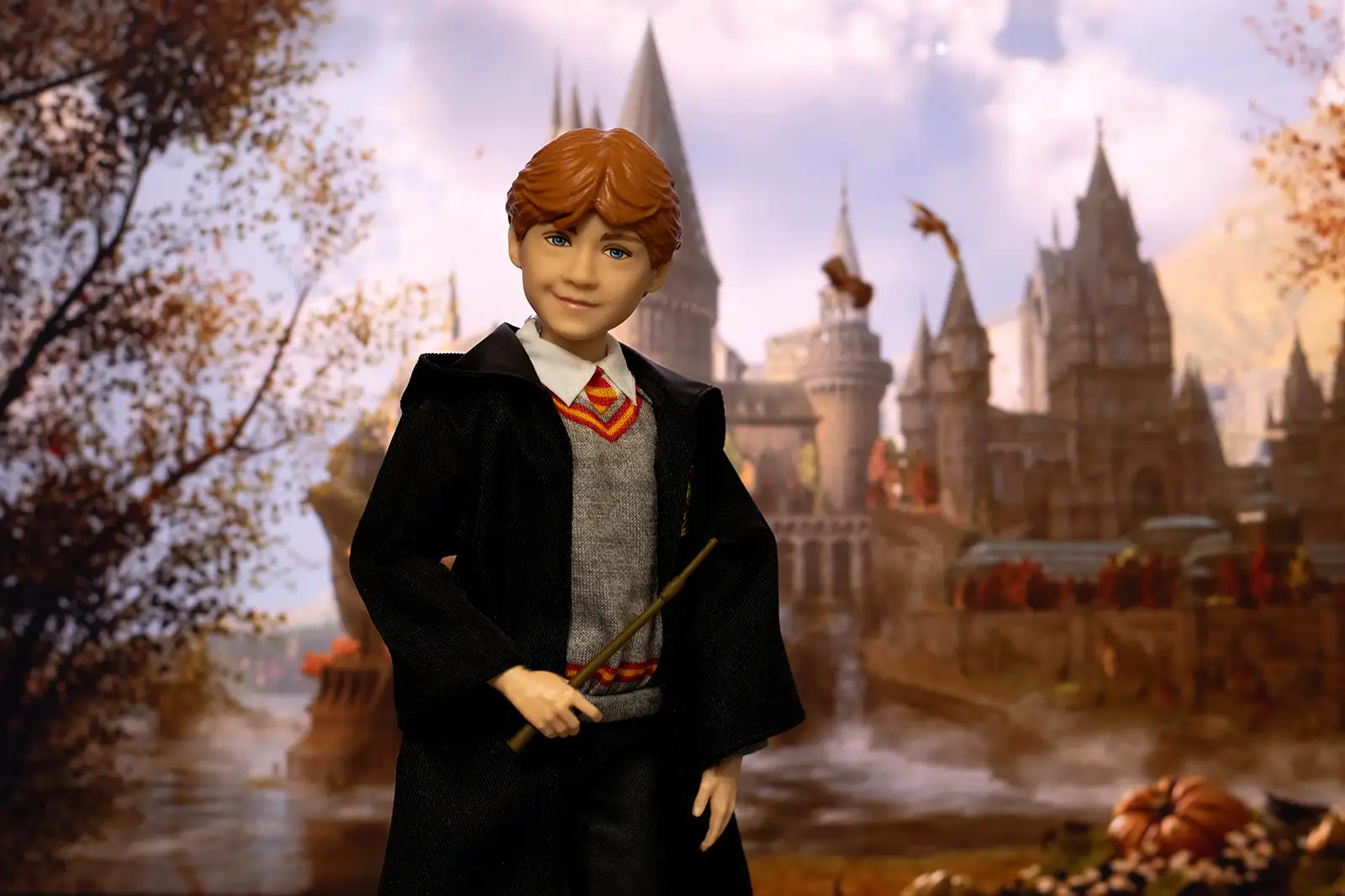 Mattel Ron Weasley doll posed with his wand at Hogwarts