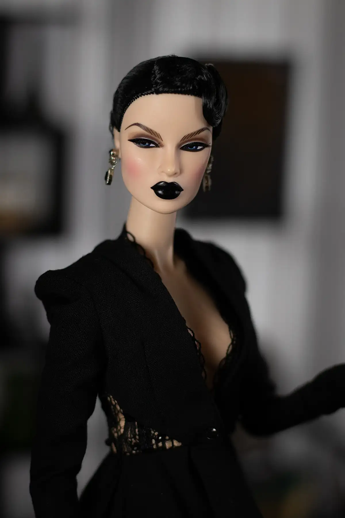 Portrait of the witch Obsidian doll in her miniature room