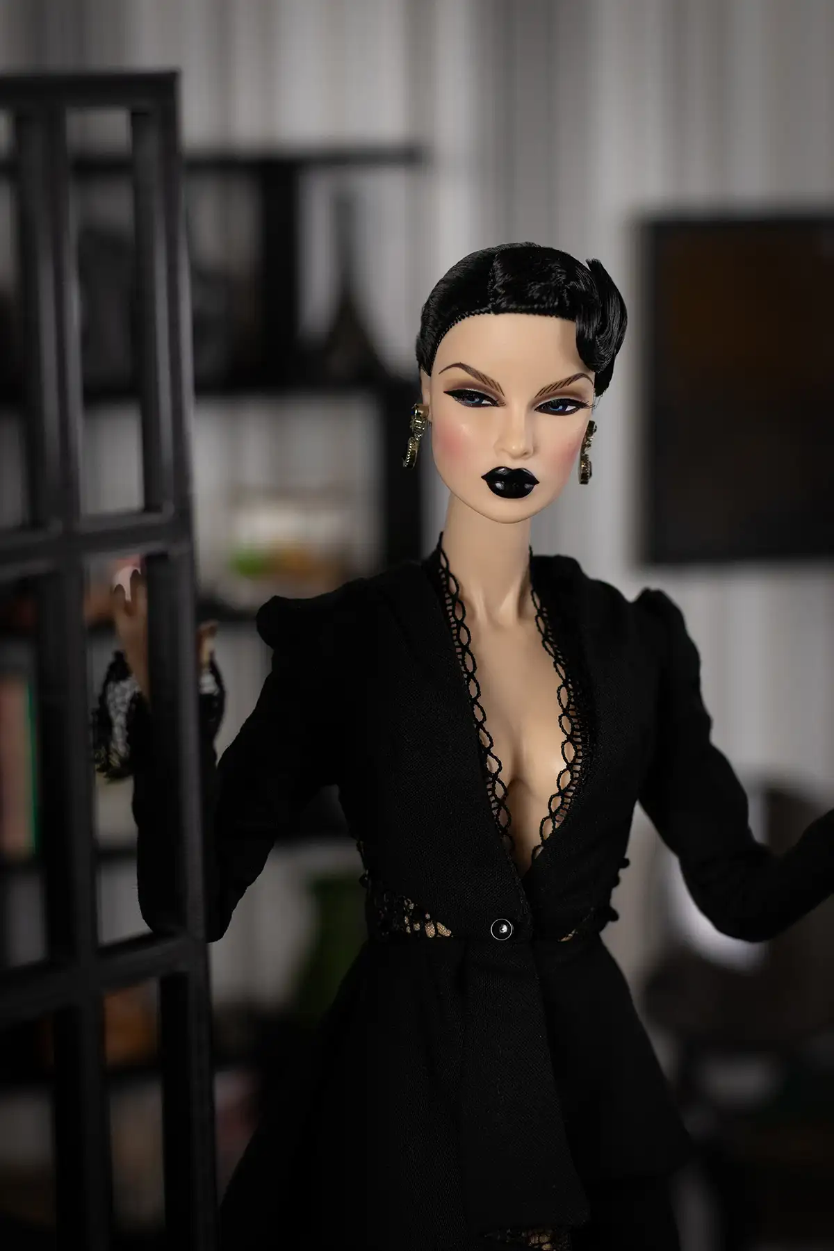 Witch Obsidian doll standing in a miniature doorway